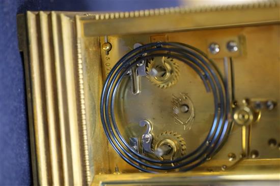 An early 20th century ormolu and porcelain hour repeating carriage clock, 6.5in., with travelling case